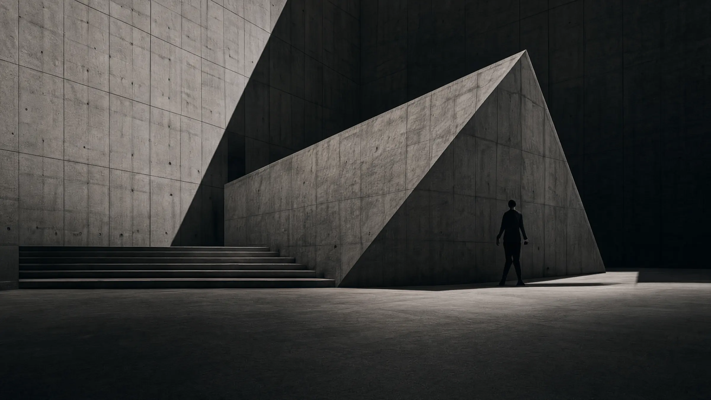 A concrete wedge cutting a hard diagonal, one figure walking its edge.